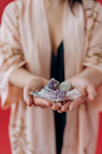 Akashic Records Practitioner Jackie Jin of Lightful Reiki in Cypress, TX Akashic Record reading Hands holding healing crystals for Reiki energy.